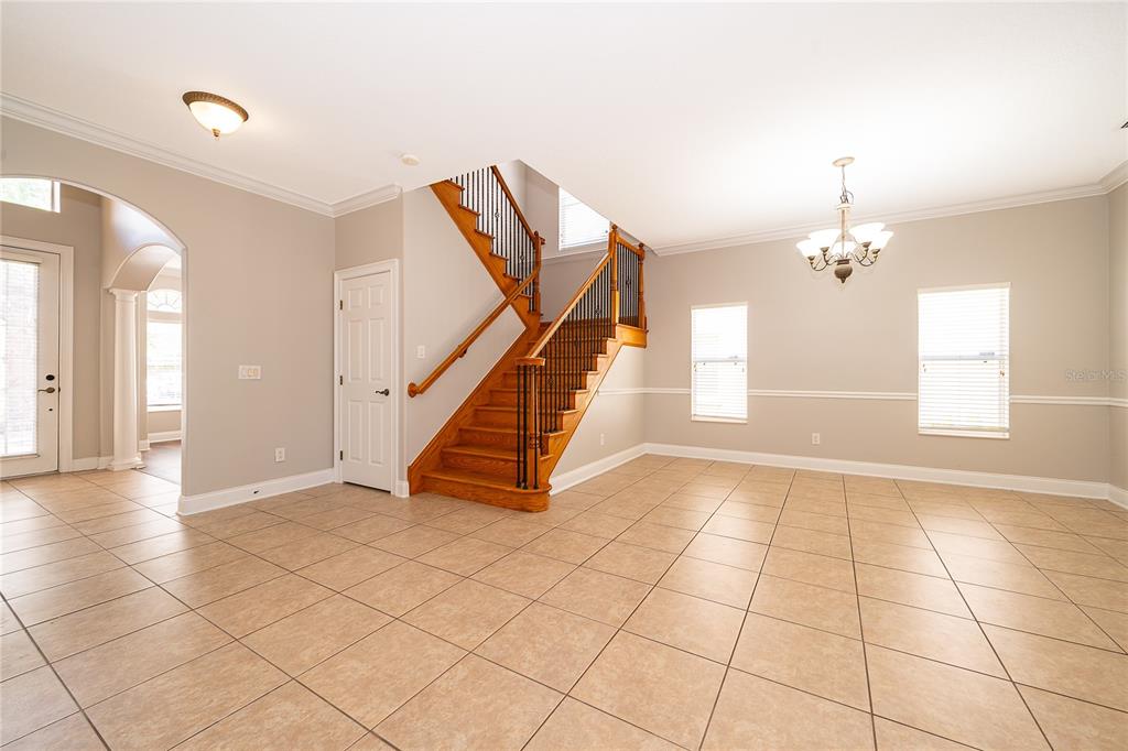 6825 Dolce Way Orlando, FL 32819 - Photo 15 of 40 a view of an entryway with wooden floor