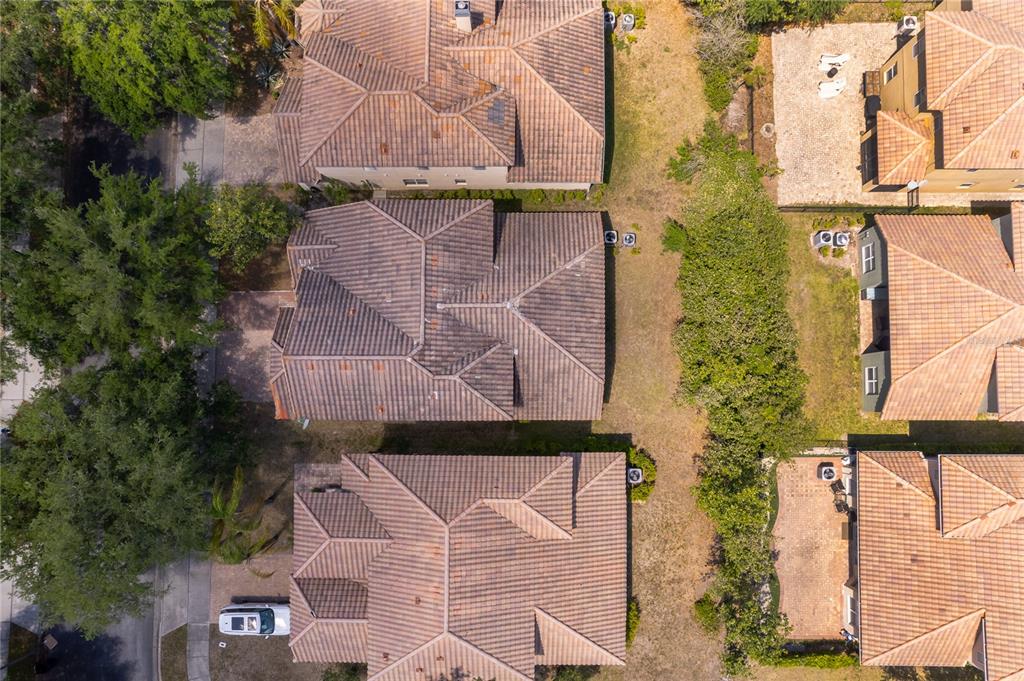 6825 Dolce Way Orlando, FL 32819 - Photo 2 of 40 an aerial view of houses with a yard