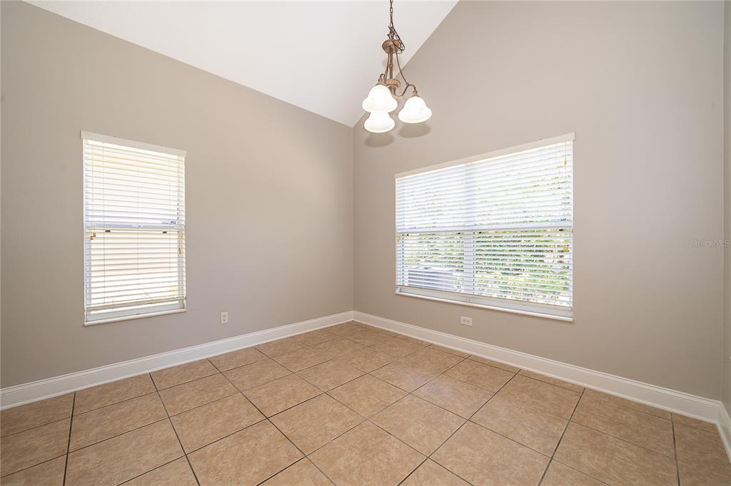 6825 Dolce Way Orlando, FL 32819 - Photo 21 of 40 a view of an empty room with a window