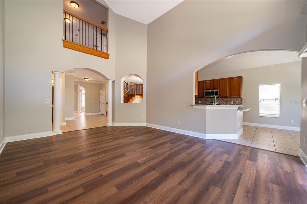 6825 Dolce Way Orlando, FL 32819 - Photo 23 of 40 a view of a kitchen from the hallway