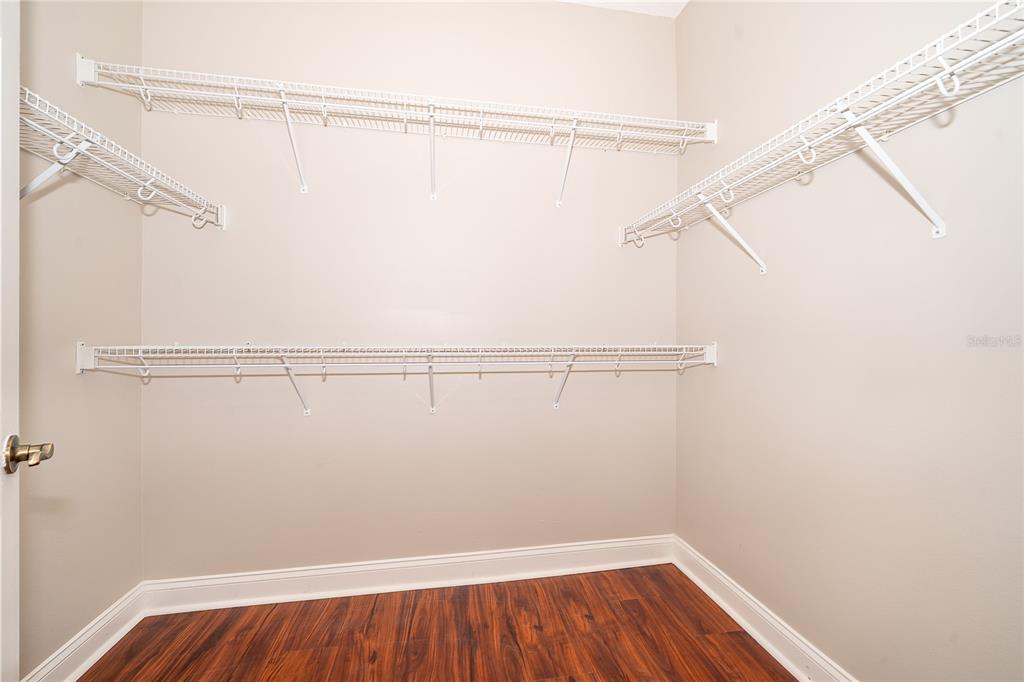6825 Dolce Way Orlando, FL 32819 - Photo 29 of 40 a view of small space with racks on the wall