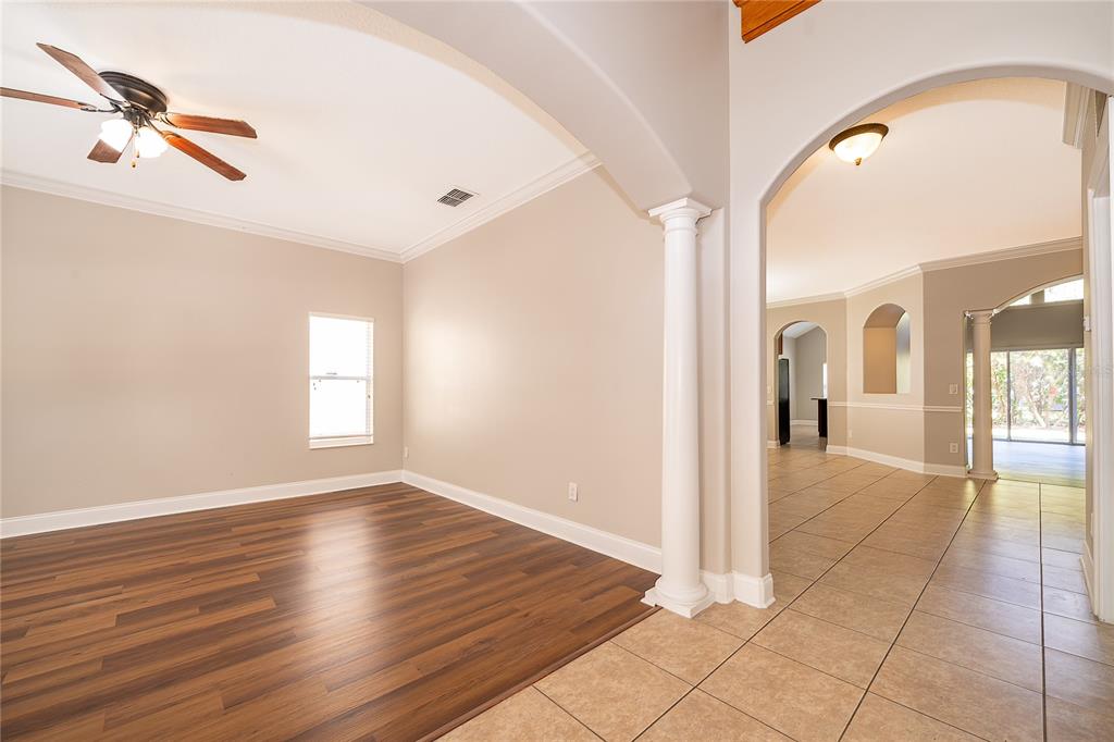 6825 Dolce Way Orlando, FL 32819 - Photo 9 of 40 a view of livingroom with hardwood floor and a ceiling fan