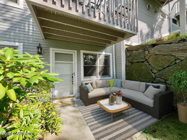 351 Pemberwick Road, Unit 206 Greenwich, CT 06831 - Photo 1 of 25 a view of a chairs and table in the patio