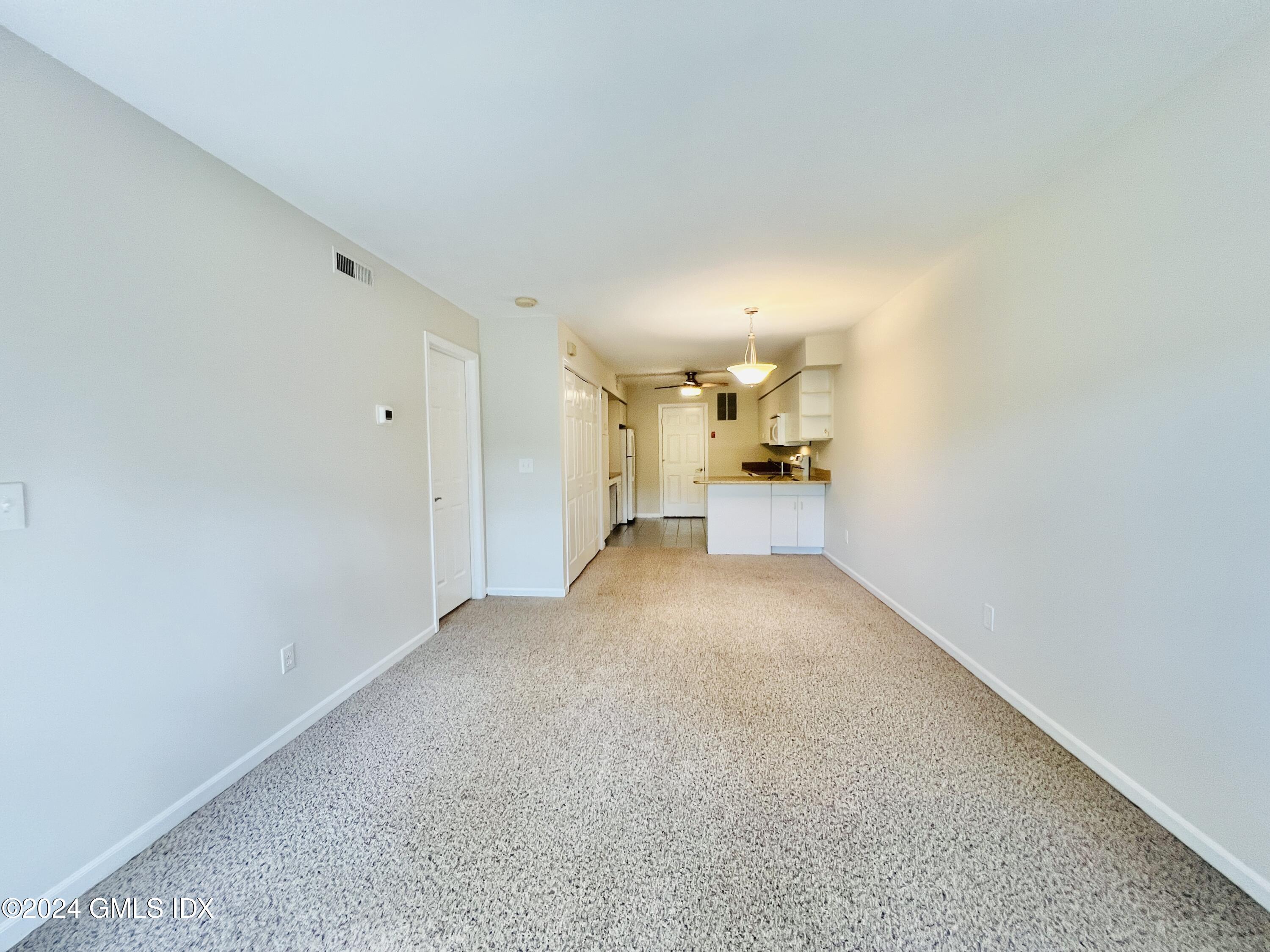 351 Pemberwick Road, Unit 206 Greenwich, CT 06831 - Photo 10 of 25 a view of empty room