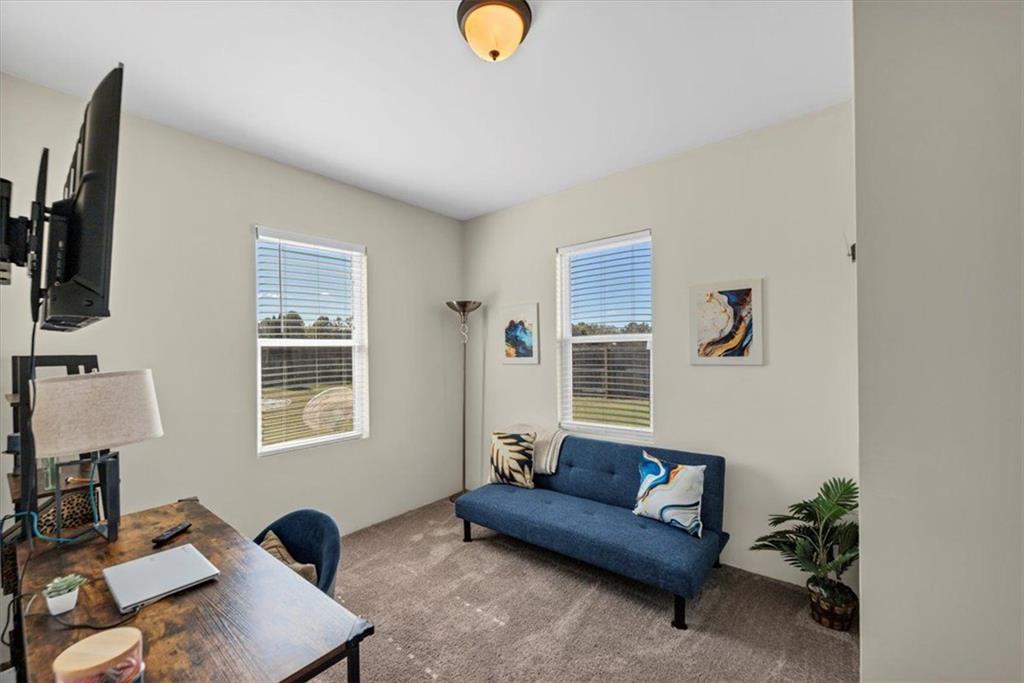 229 Summer Gate Lane Villa Rica, GA 30180 - Photo 19 of 28 a living room with furniture and a window