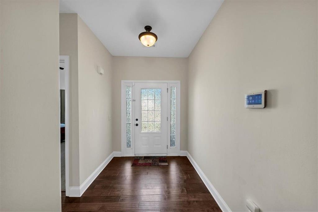 229 Summer Gate Lane Villa Rica, GA 30180 - Photo 4 of 28 a view of a hallway with wooden floor