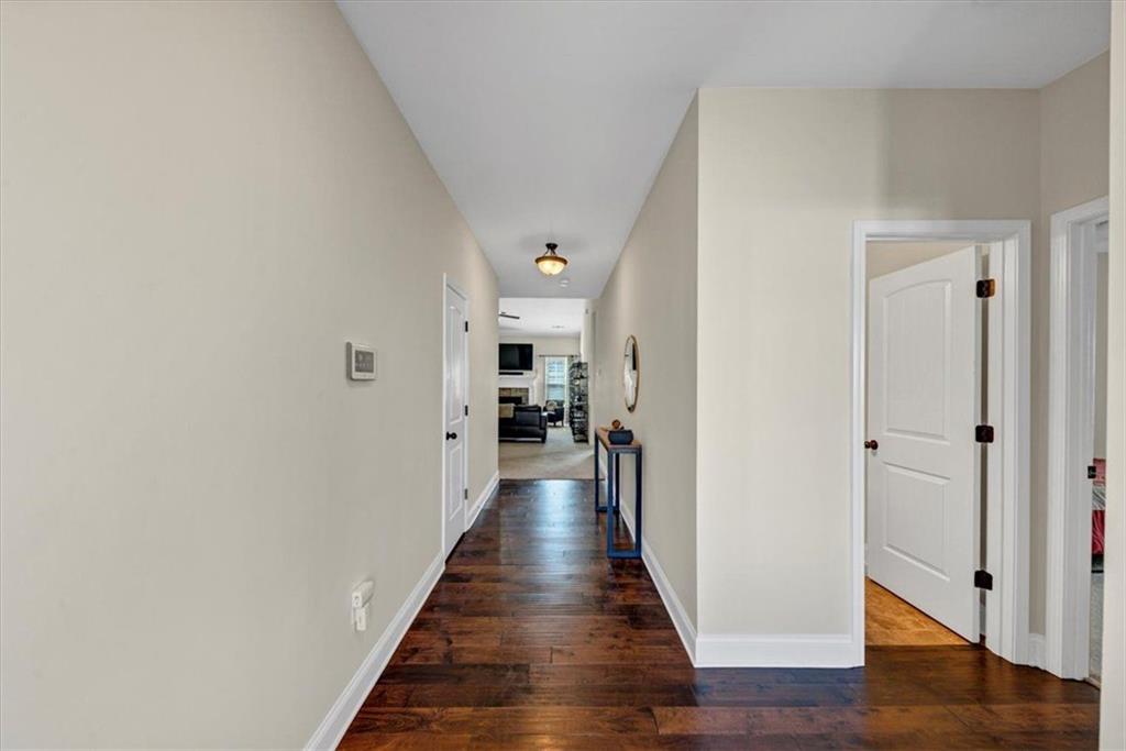 229 Summer Gate Lane Villa Rica, GA 30180 - Photo 5 of 28 a view of a hallway with the wooden floor