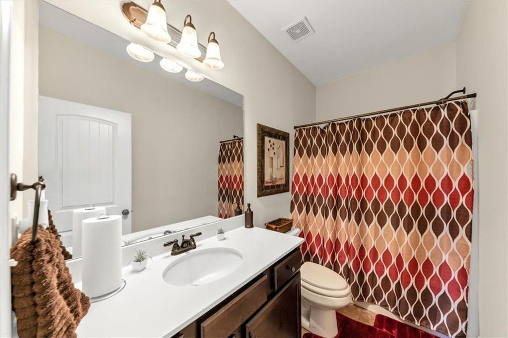 229 Summer Gate Lane Villa Rica, GA 30180 - Photo 8 of 28 a bathroom with a sink a toilet and a mirror