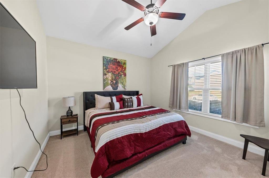229 Summer Gate Lane Villa Rica, GA 30180 - Photo 9 of 28 a bedroom with a bed and a large window