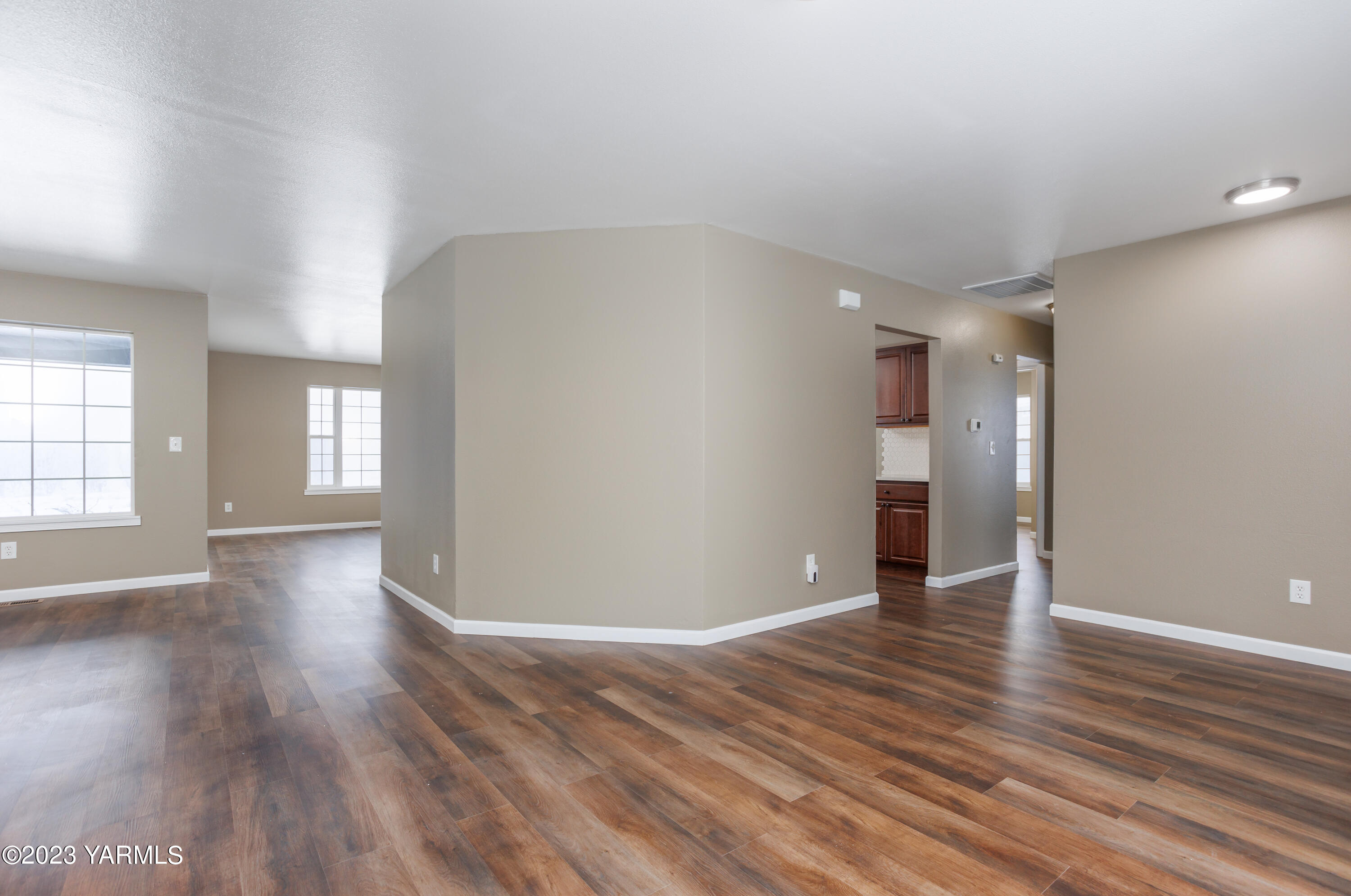 361 Puterbaugh Road Grandview, WA 98930 - Photo 13 of 47 wooden floor in an empty room with a window
