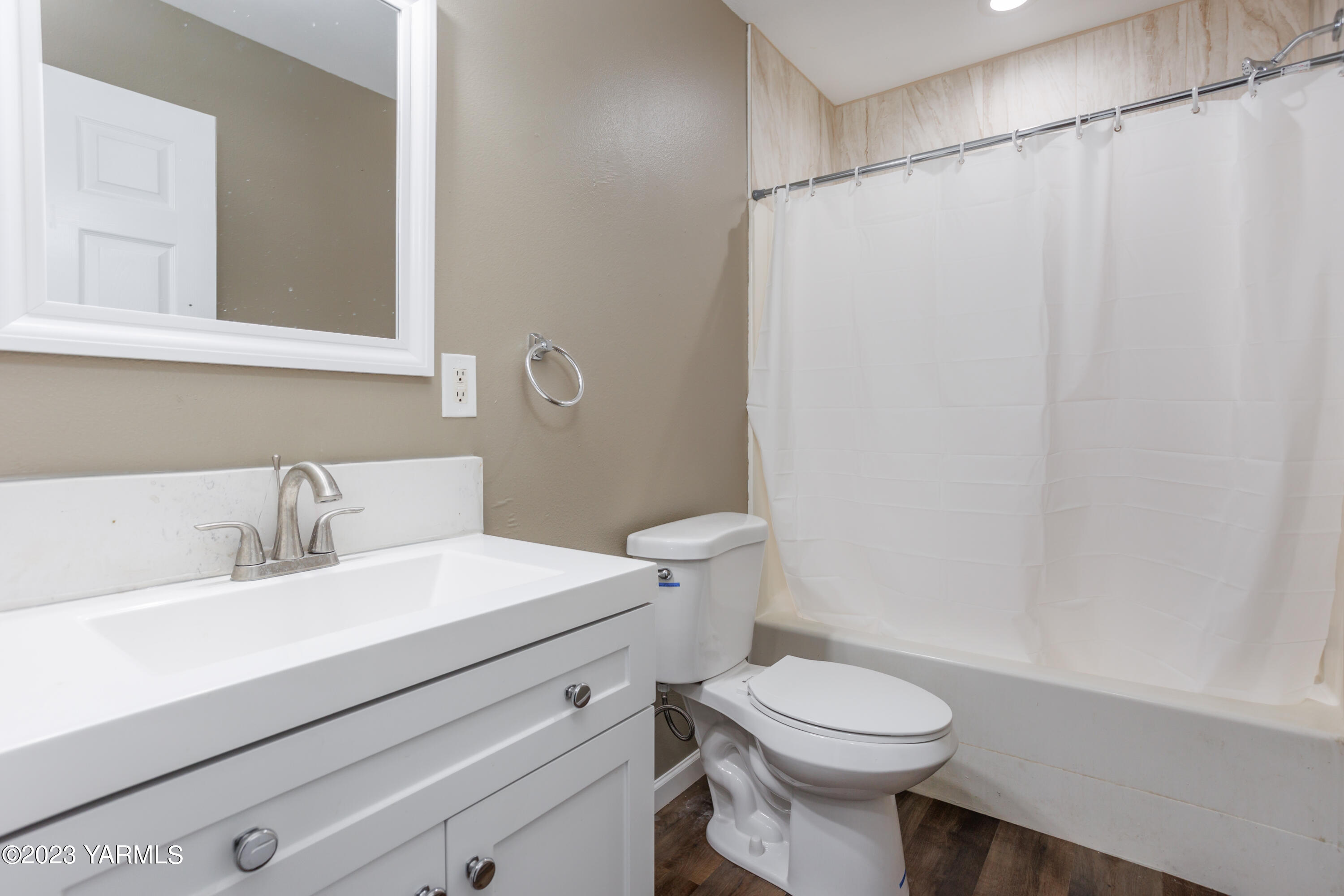 361 Puterbaugh Road Grandview, WA 98930 - Photo 17 of 47 a bathroom with a sink a toilet and a mirror