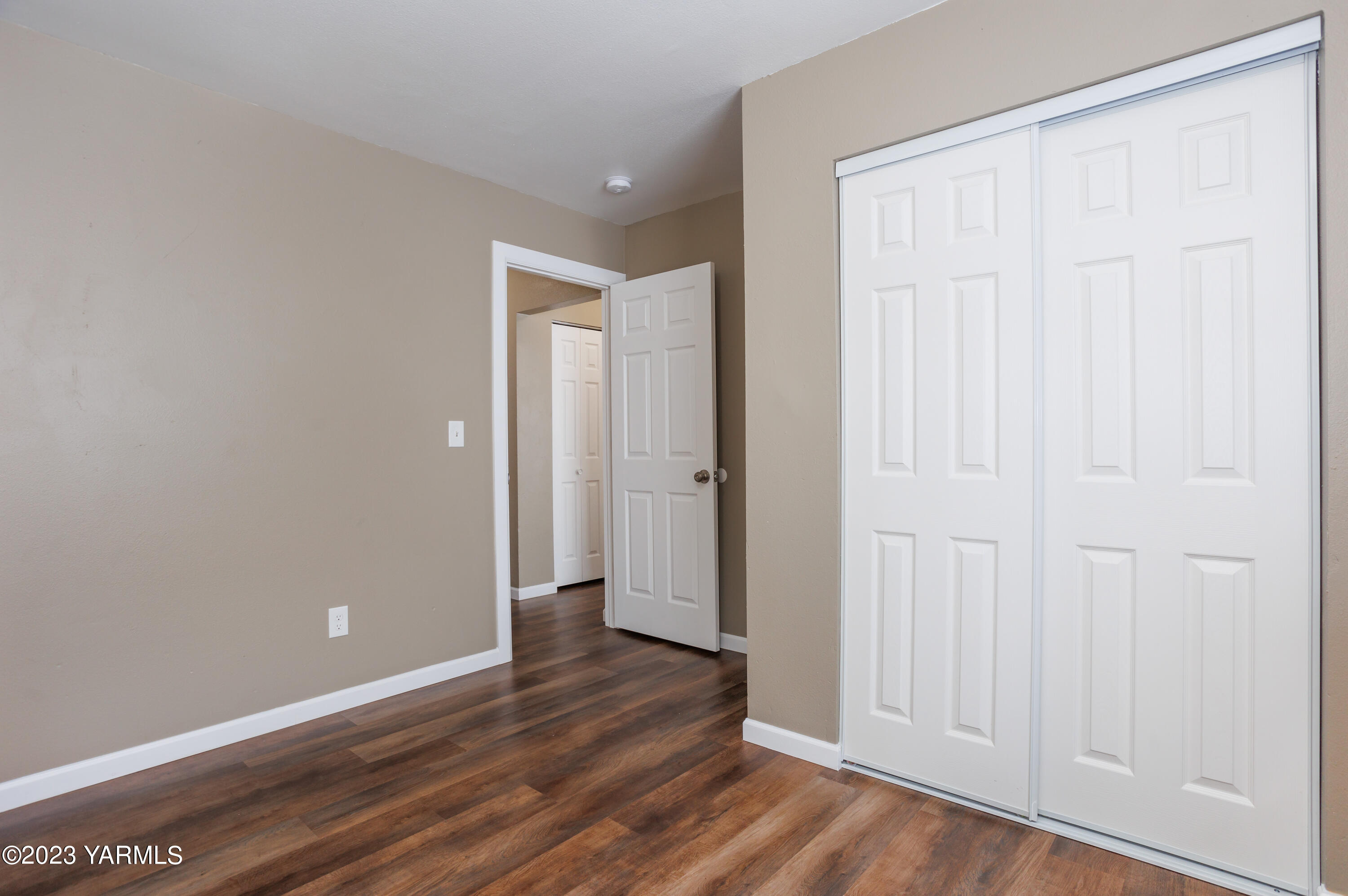 361 Puterbaugh Road Grandview, WA 98930 - Photo 22 of 47 a view of an empty room with wooden floor