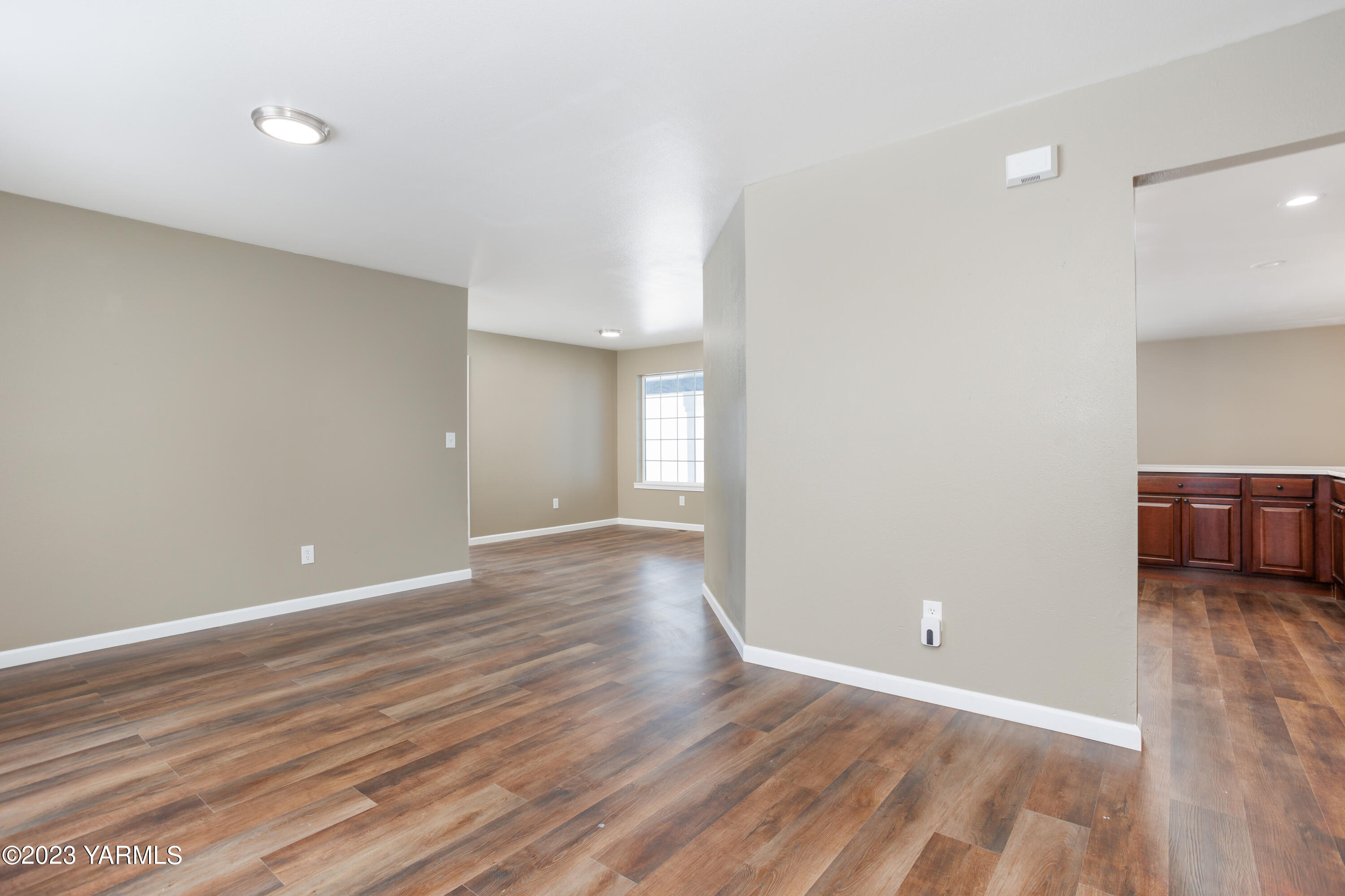361 Puterbaugh Road Grandview, WA 98930 - Photo 26 of 47 a view of a room with wooden floor and window