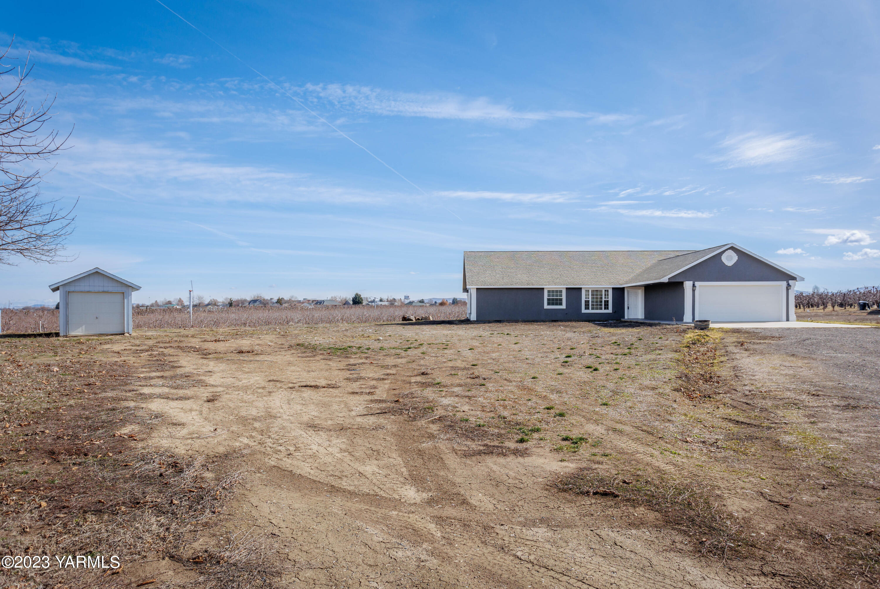 361 Puterbaugh Road Grandview, WA 98930 - Photo 46 of 47 a view of a house with a yard