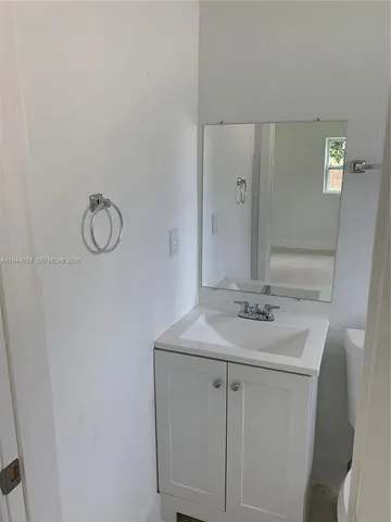 a kitchen that has a sink and a stove in it