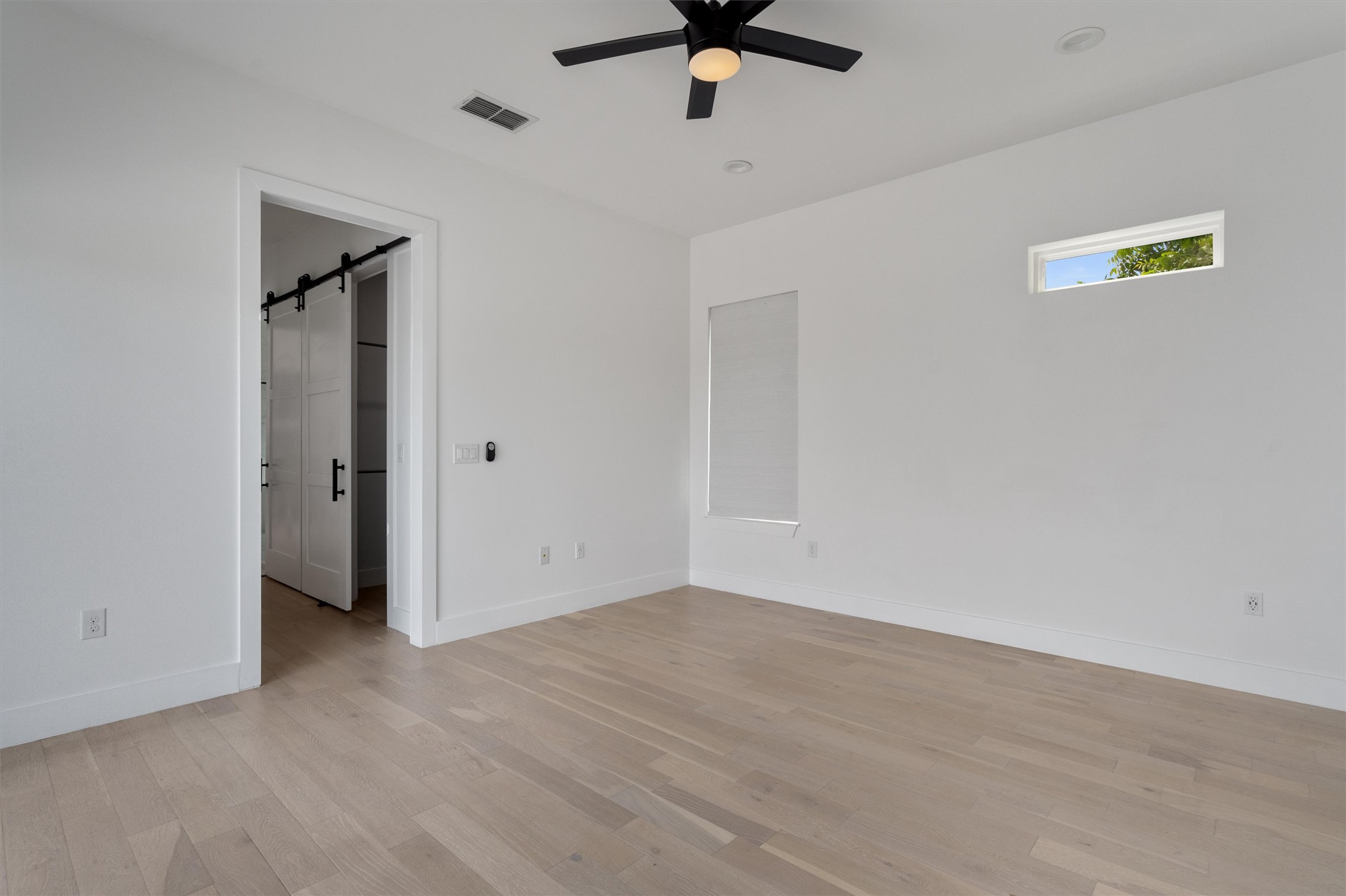 4712 Reyes Street, Unit 1 Austin, TX 78721 - Photo 21 of 38 wooden floor in an empty room