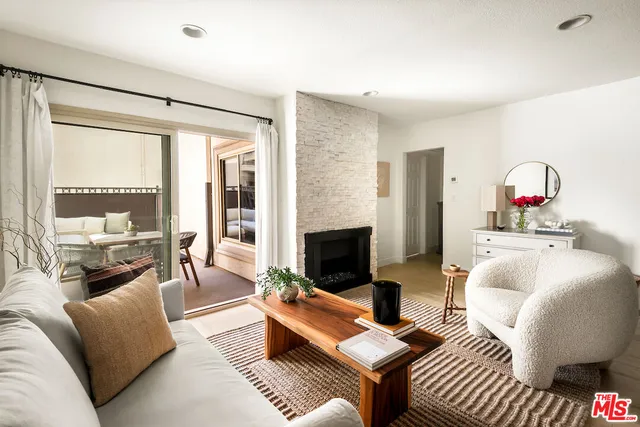 a living room with furniture fireplace and a flat screen tv