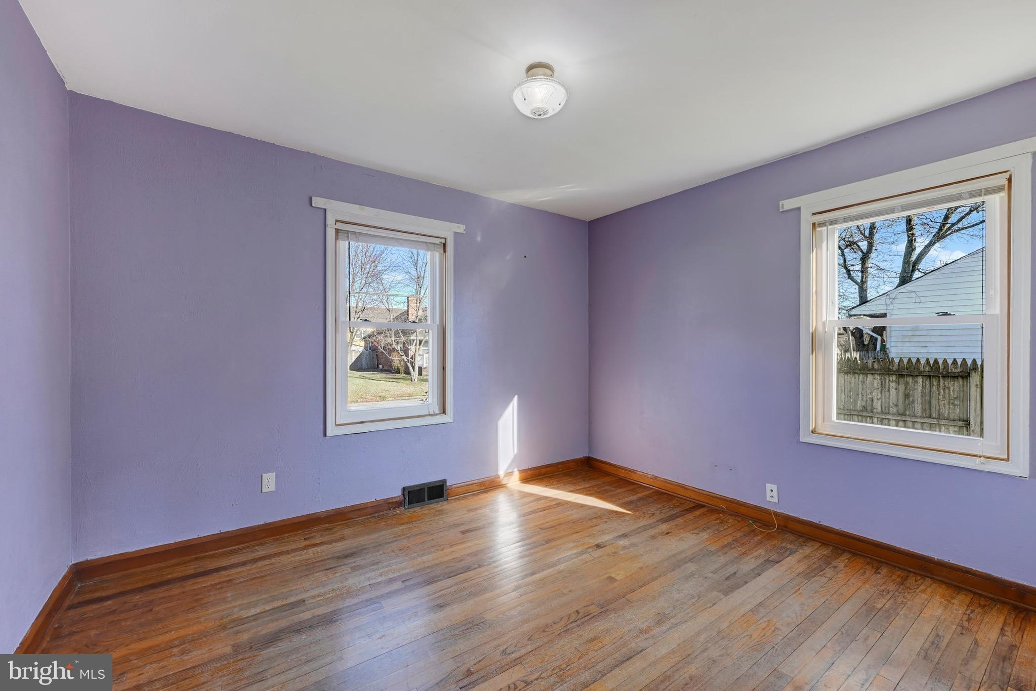 38 Mitchell Avenue Aberdeen, MD 21001 - Photo 11 of 15 a view of an empty room with wooden floor and a window