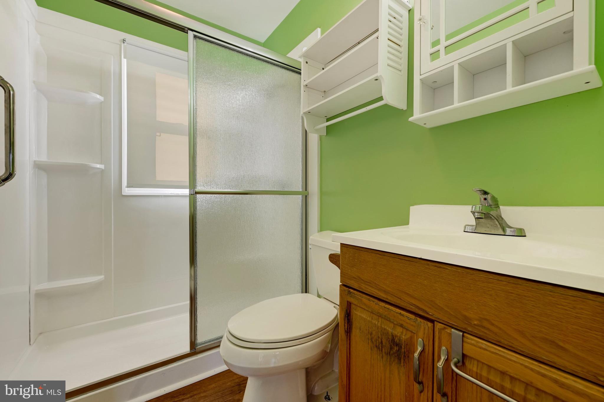 38 Mitchell Avenue Aberdeen, MD 21001 - Photo 12 of 15 a bathroom with a sink toilet and shower