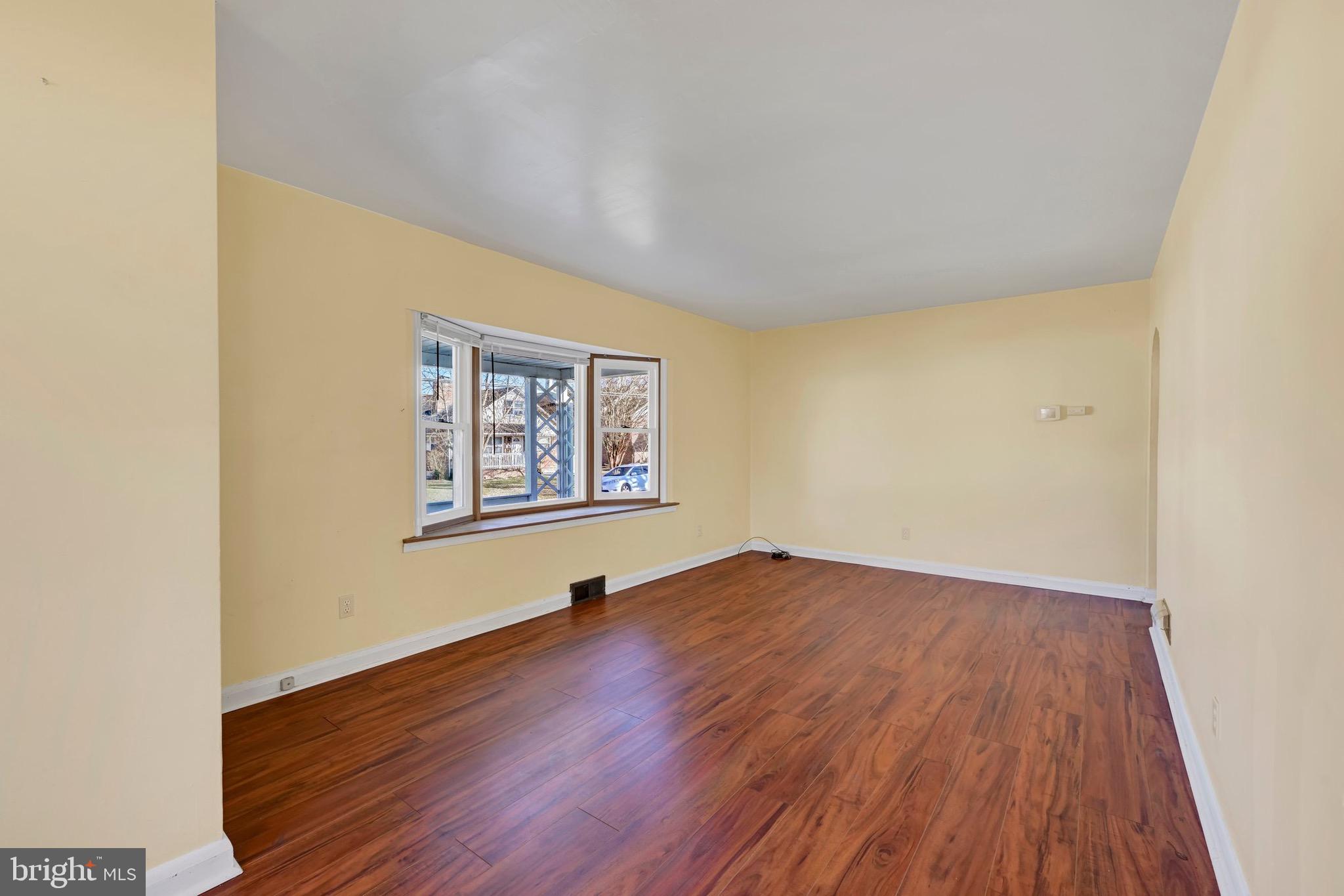 38 Mitchell Avenue Aberdeen, MD 21001 - Photo 6 of 15 an empty room with wooden floor and window