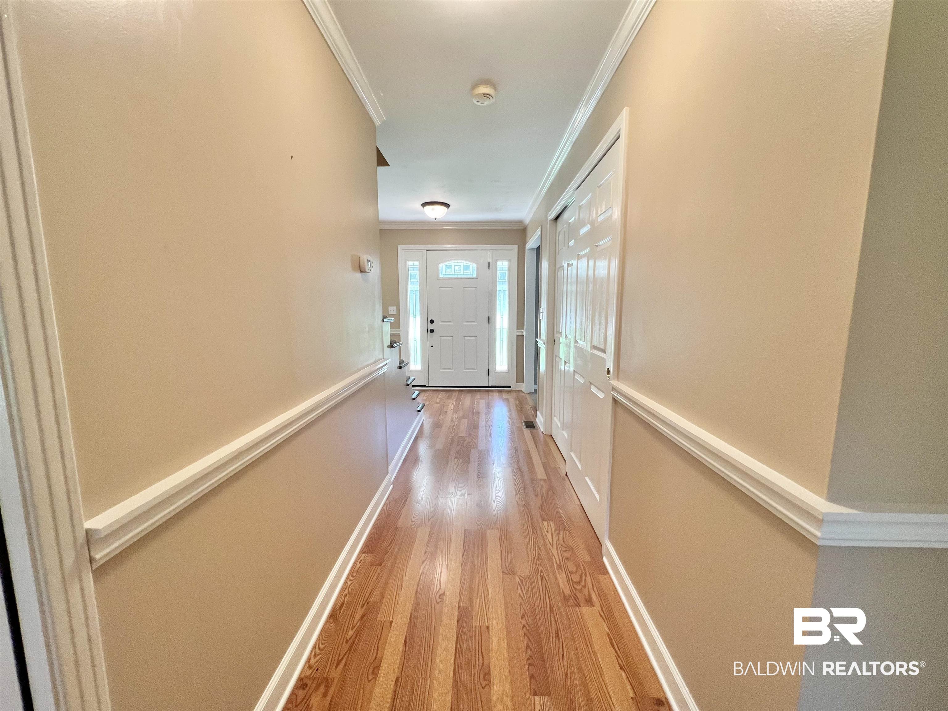 2691 Appleton Road Brewton, AL 36426 - Photo 22 of 60 Corridor with light wood-style flooring and crown molding