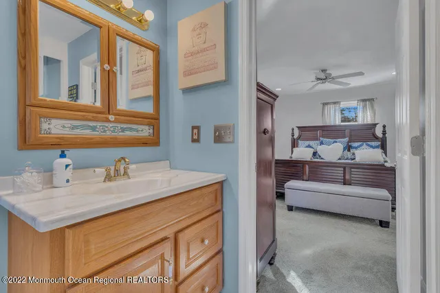 a bedroom with a bed and flat screen tv