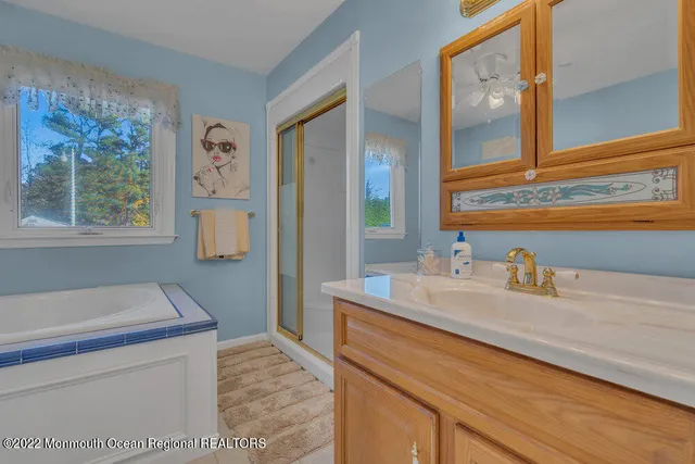 a bedroom with furniture and a flat screen tv