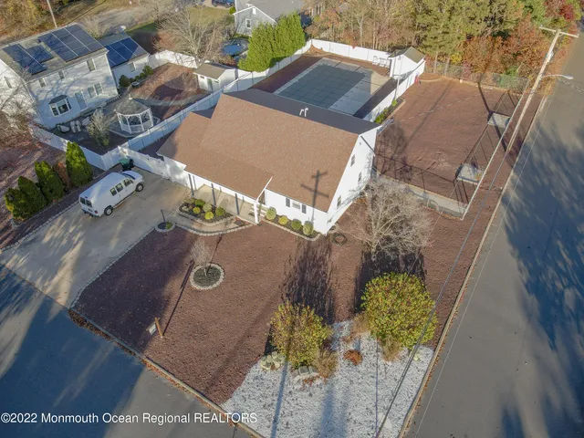 an aerial view of a house with outdoor space