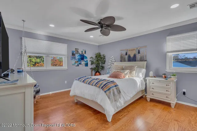 a room with pool table and a rug