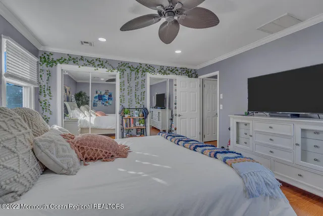 a bedroom with a bed and a cabinets