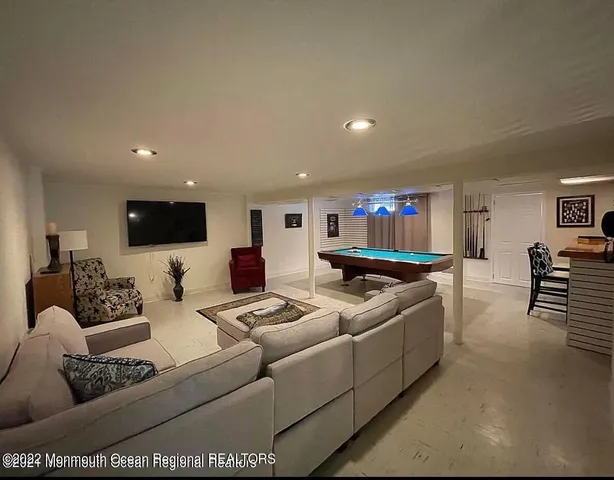a view of a balcony with wooden floor and seating space