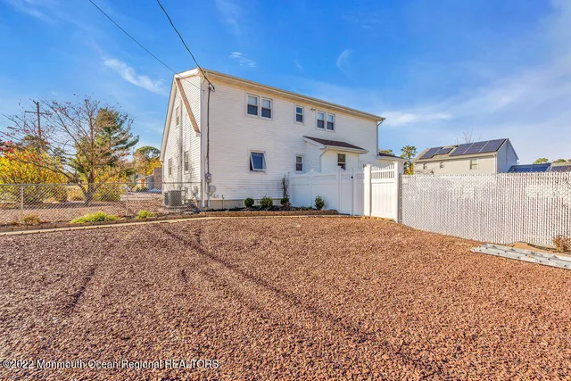 a patio with a table and chairs