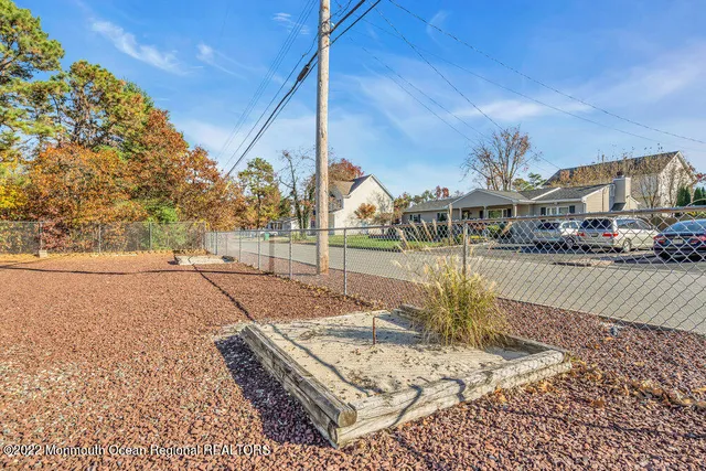 a view of a kitchen with a sink and cabinets