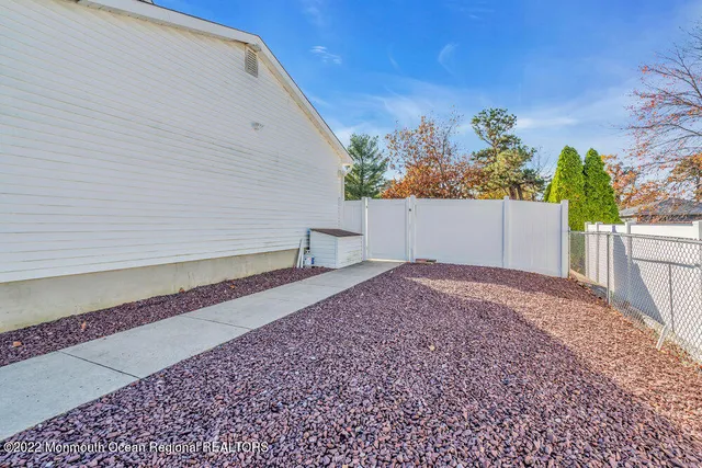 a view of chair and table in the back yard