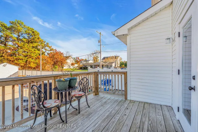 a bedroom with a bed and a mirror on dresser