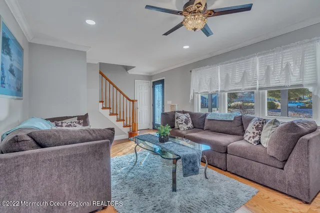a large kitchen with stainless steel appliances kitchen island granite countertop a sink and cabinets