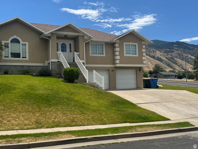 88 Canterbury Lane Logan, UT 84321 - Photo 2 of 37 Stucco exterior with a peaked roofline and prominent front entrance