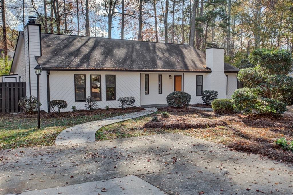1010 Mathews Court, Unit A Smyrna, GA 30080 - Photo 1 of 1 a front view of house with yard and trees around