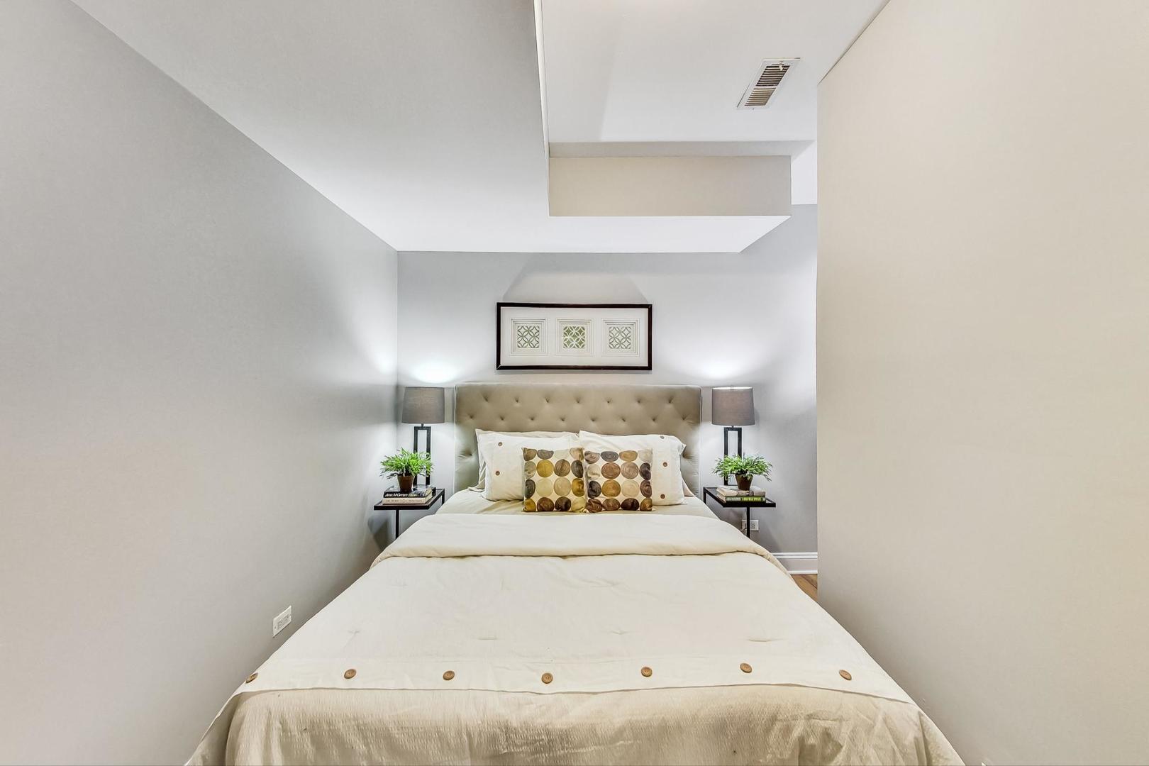 3734 North Clifton Avenue, Unit G Chicago, IL 60613 - Photo 14 of 27 a bedroom with a bed and window