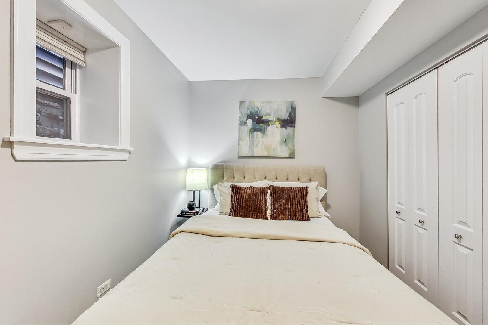 3734 North Clifton Avenue, Unit G Chicago, IL 60613 - Photo 17 of 27 a bedroom with a bed and a window