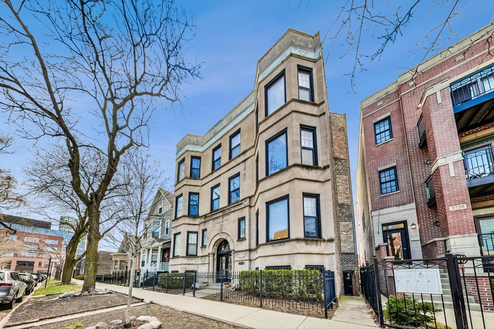 3734 North Clifton Avenue, Unit G Chicago, IL 60613 - Photo 3 of 27 a front view of a residential apartment building with a yard