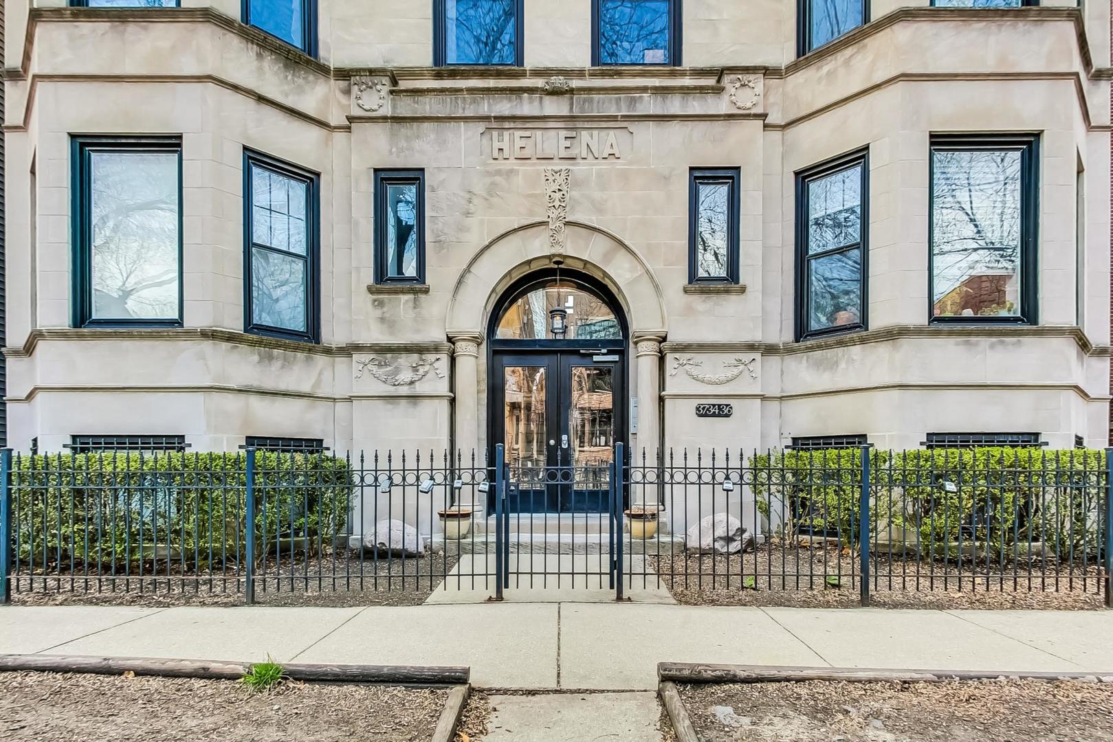 3734 North Clifton Avenue, Unit G Chicago, IL 60613 - Photo 4 of 27 a view of a brick house with large windows