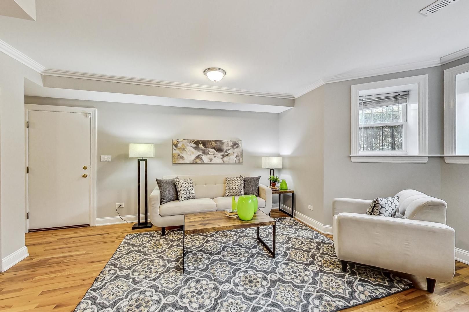 3734 North Clifton Avenue, Unit G Chicago, IL 60613 - Photo 7 of 27 a living room with furniture and a window