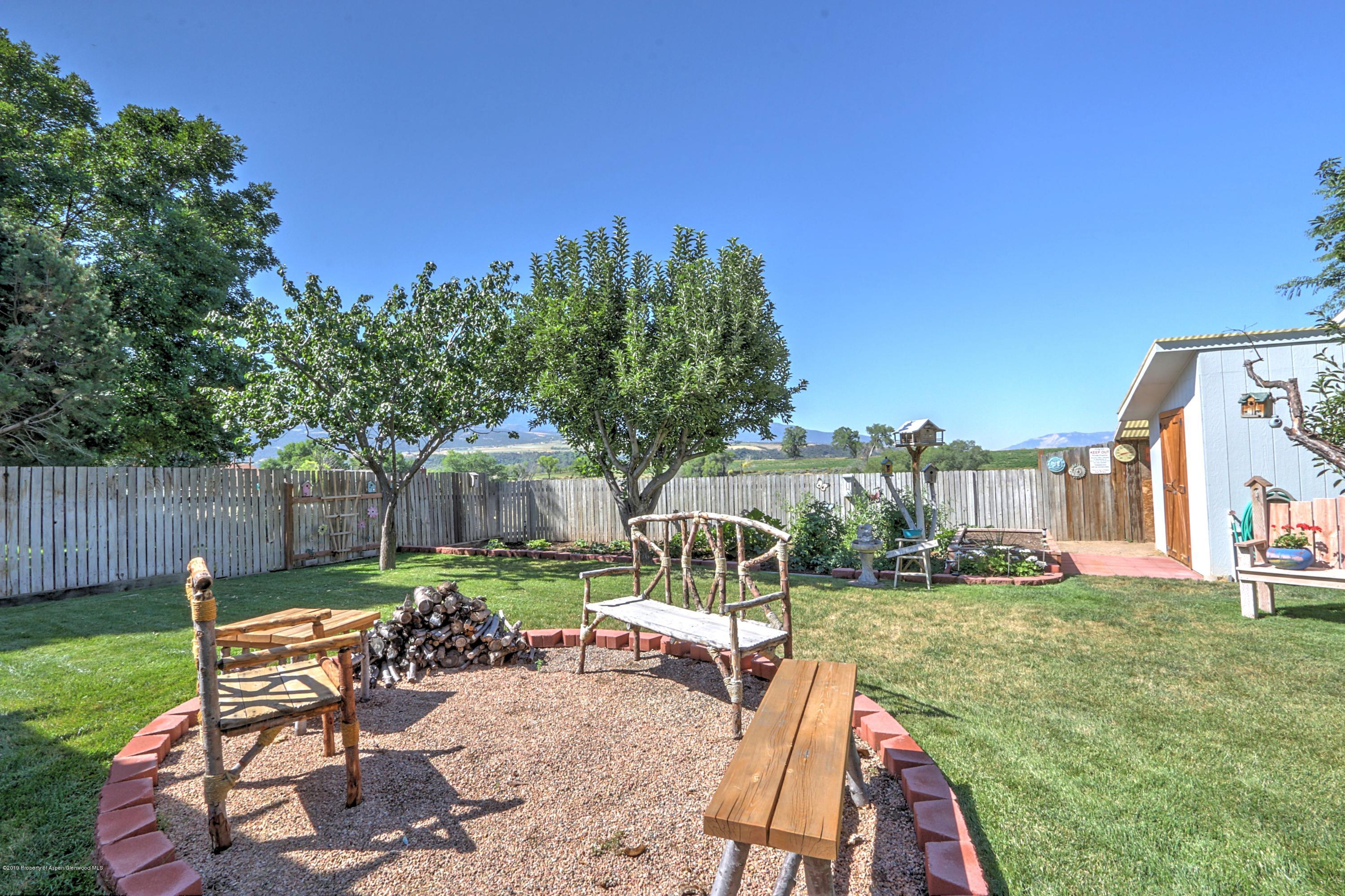 681 Mesa Avenue Rifle, CO 81650 - Photo 22 of 28 firepit and fruit trees