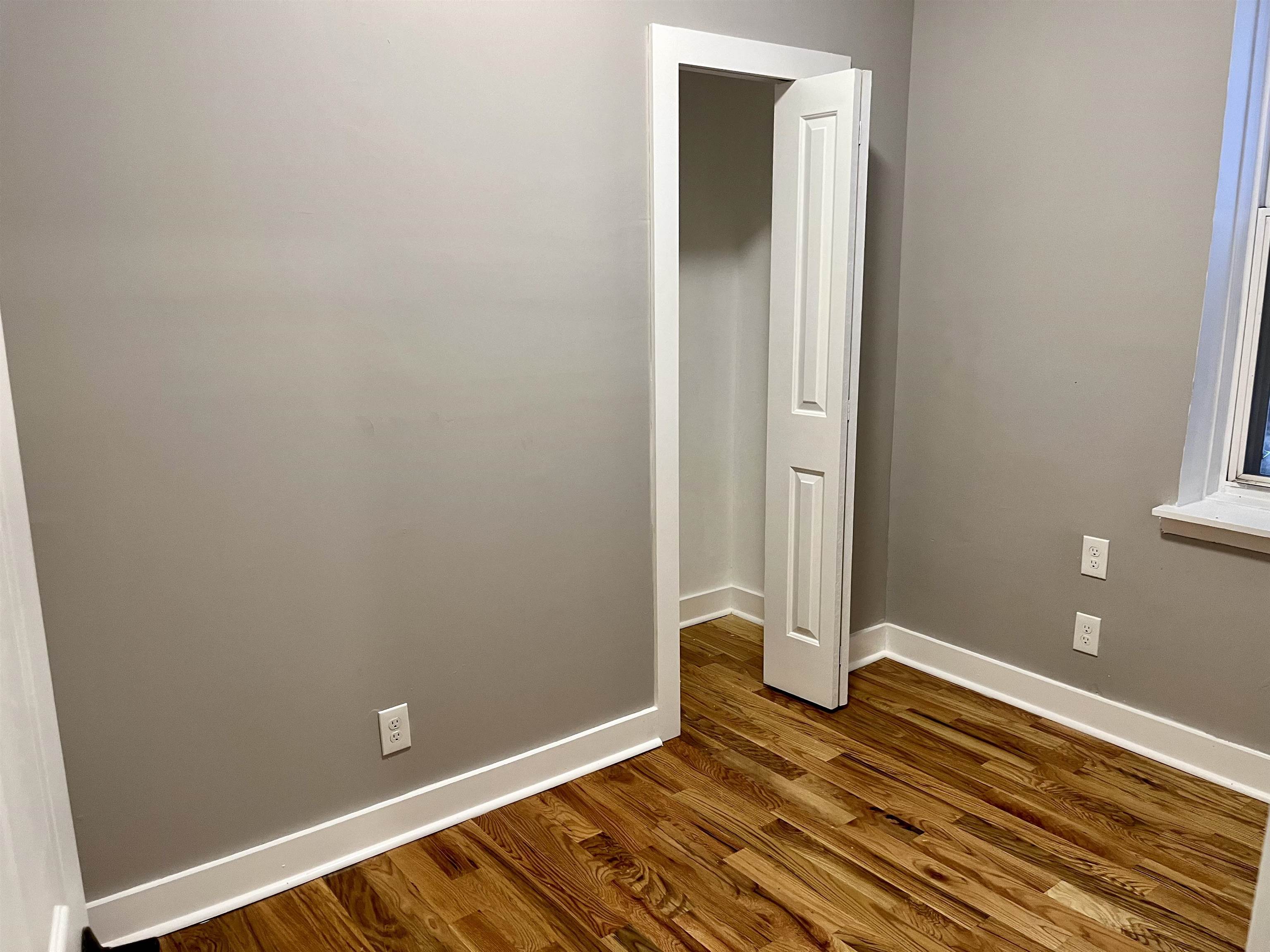 514 John F. Kennedy Boulevard, Unit 1 Bayonne, NJ 07002 - Photo 7 of 7 a view of room with wooden floor