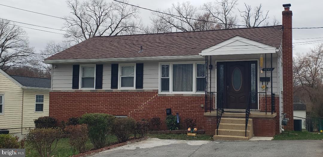 9207 4th Street Lanham, MD 20706 - Photo 2 of 14 a view of brick house with large windows