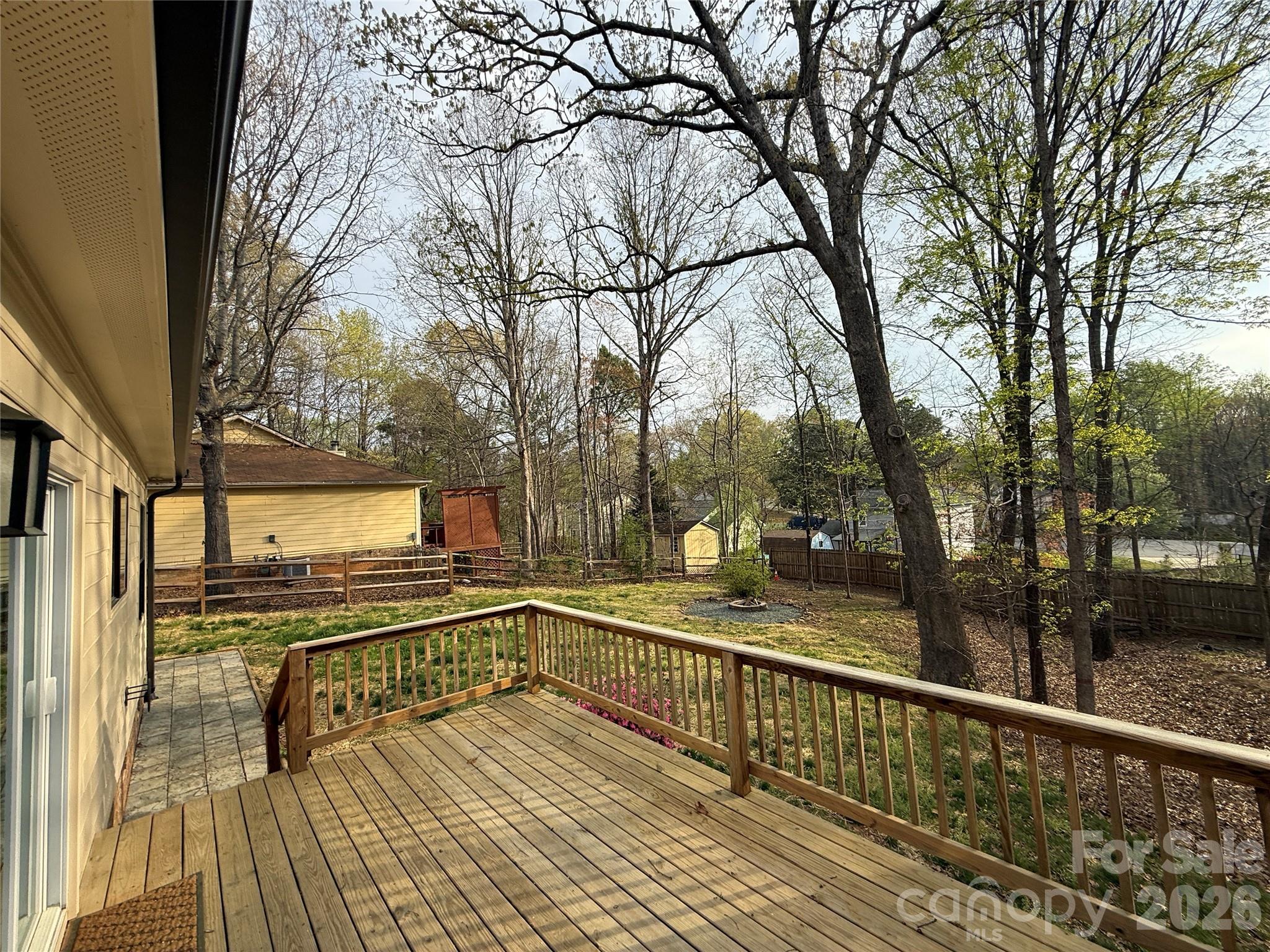 10129 Rockwood Road Charlotte, NC 28215 - Photo 25 of 36 a view of a balcony with wooden floor and outdoor seating