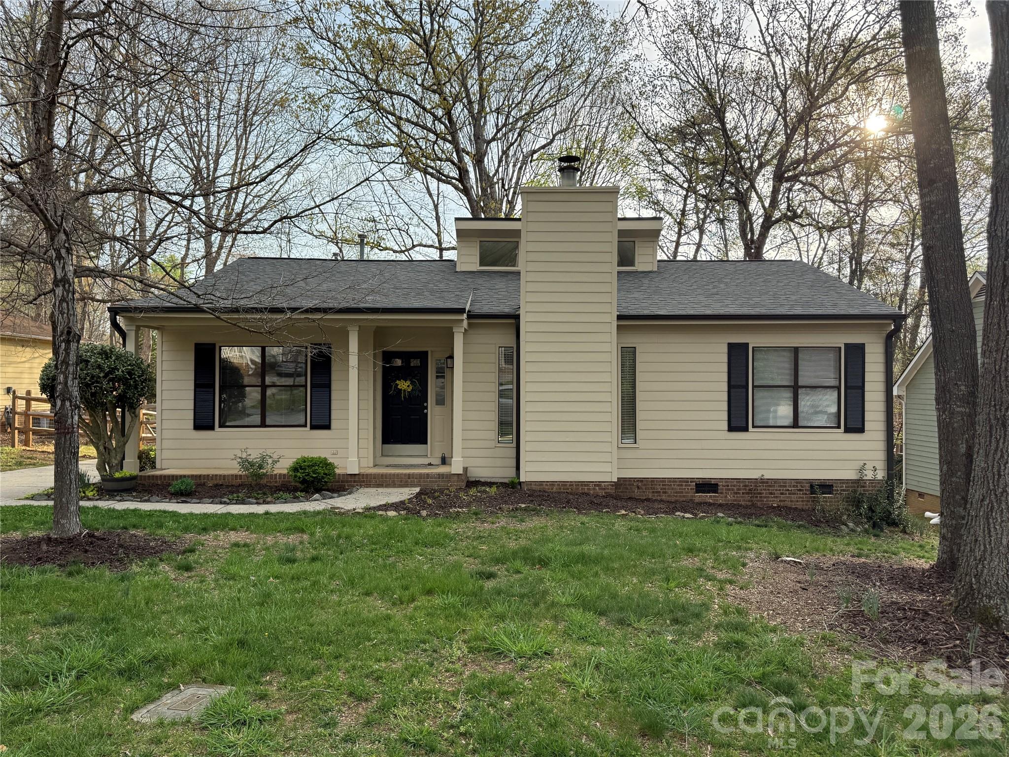 10129 Rockwood Road Charlotte, NC 28215 - Photo 3 of 36 a front view of a house with a yard