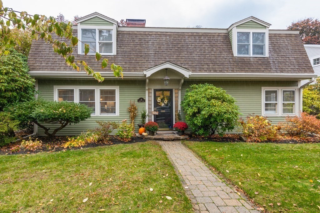 15 Carlton Road Marblehead, MA 01945 - Photo 1 of 37 a front view of a house with a garden and plants