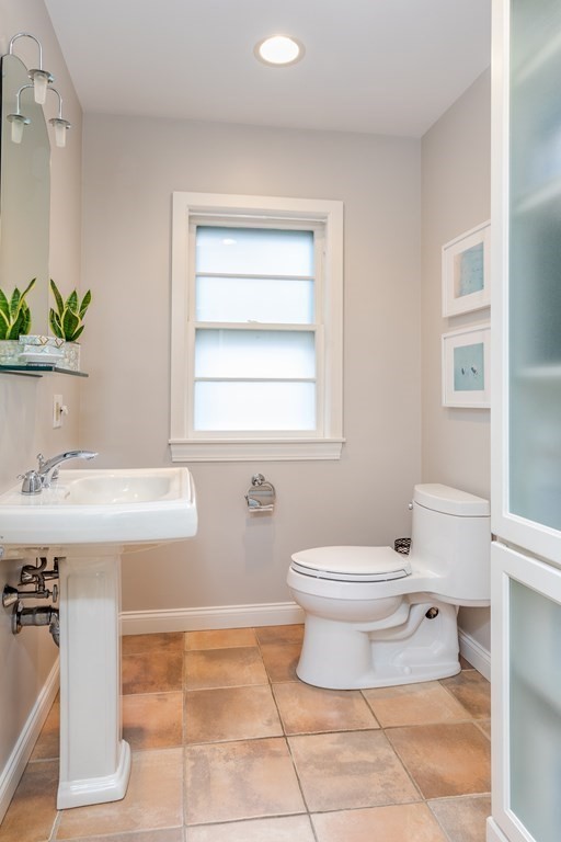15 Carlton Road Marblehead, MA 01945 - Photo 16 of 37 a bathroom with a sink toilet and a mirror